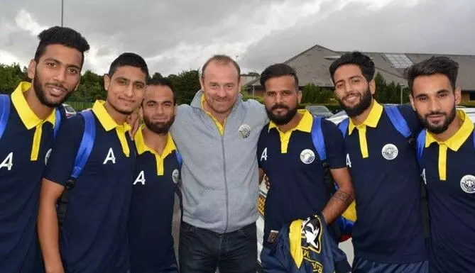 David Robertson with Real Kashmir FC players