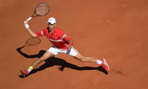 Novak Djokovic tops Tsitsipas in 5 at French Open for 19th major