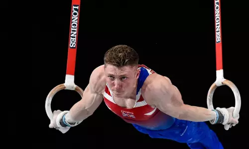 A gymnast performing a routine A gymnast performing a routine