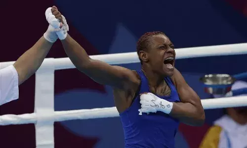 Oshae Jones celebrating at Pan-American Games after winning the gold medal bout