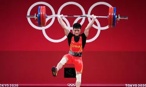 Chinese Weightlifter Li Fabin with the Flamingo Lift