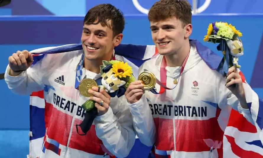 Tom Daley and Matt Lee after winning gold at Tokyo Olympics (Source: The Guardian)