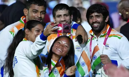 Indian athletes clicking selfies during Tokyo Olympics closing ceremony. Indian athletes clicking selfies during Tokyo Olympics closing ceremony.