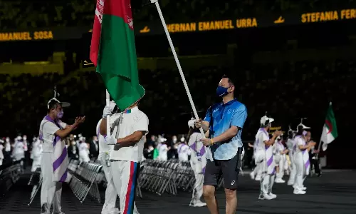 The Afghanistan flag being hoisted in solidarity (Sources: USA Today)