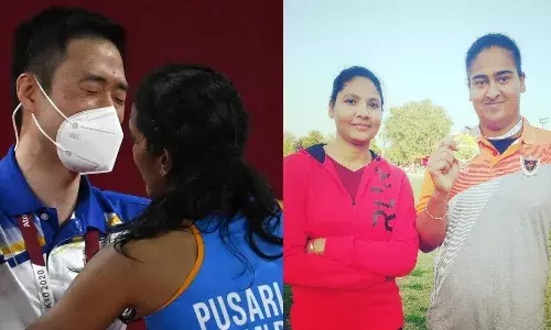 PV Sindhu and Kamalpreet Kaur with their coaches Park Tae Sang and Rakhi Tyagi, respectively.
