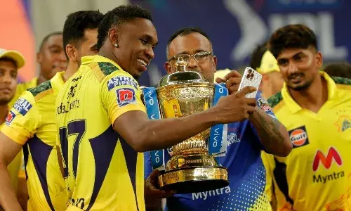 Dwayne Bravo celebrating with the 16th trophy in his career [Source: IPL]