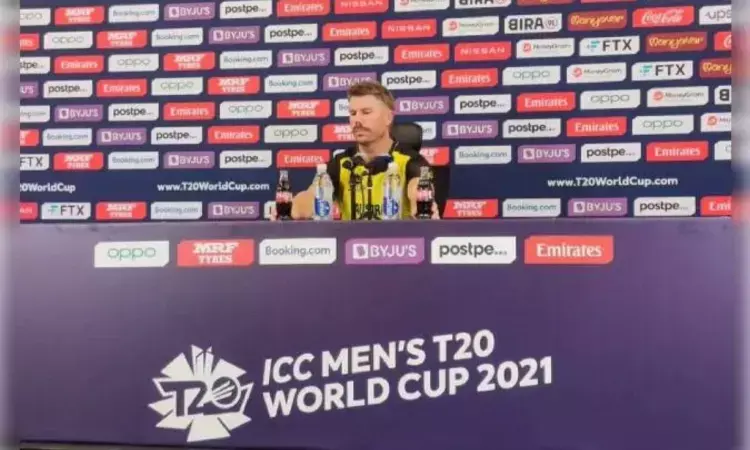 David Warner jokingly removes Coca Cola bottles at the press conference