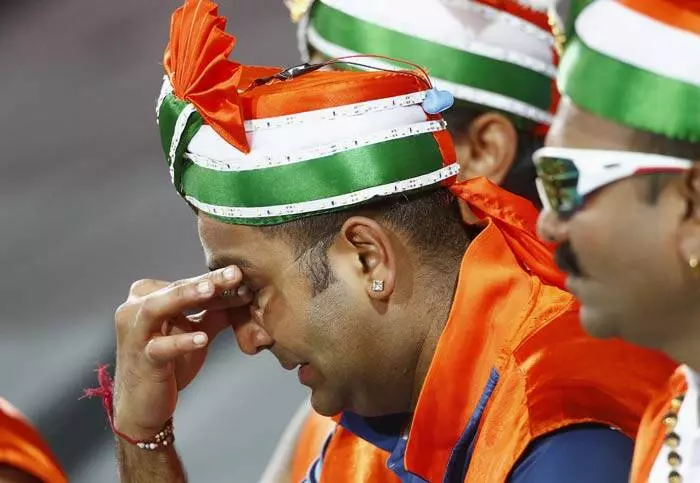 A grieving Indian fan after a hard loss (Source: Reuters)