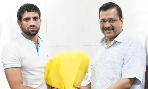 Ravi Dahiya and Delhi CM Arvind Kejriwal (Source: AAP/Twitter) Ravi Dahiya and Delhi CM Arvind Kejriwal (Source: AAP/Twitter)