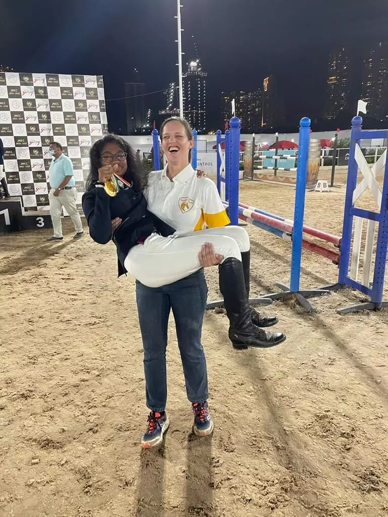 A victorious Kavya Gopal with her coach