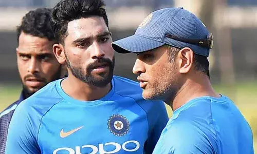 Mohammed Siraj and MS Dhoni interacting during an Indian training camp (Source: TOI)