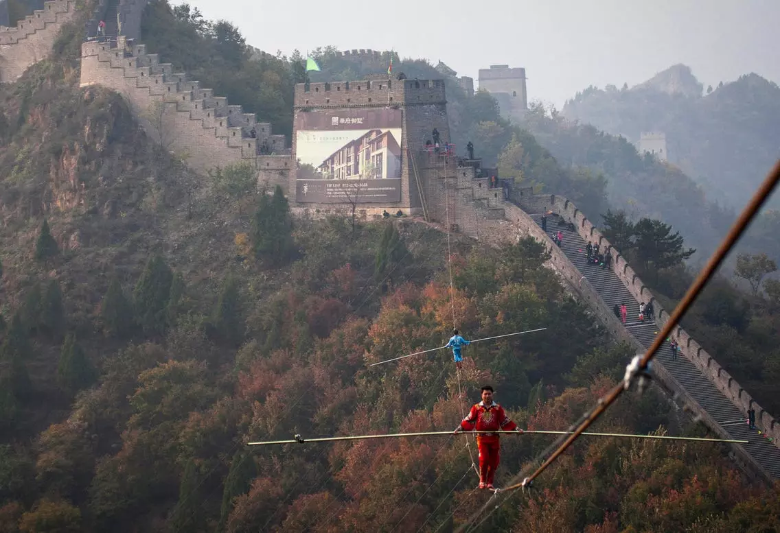 Tightrope walkers near the Great Wall(source-businessinsider)