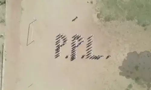 Pro Panja logo created by young arm wrestlers using human formation