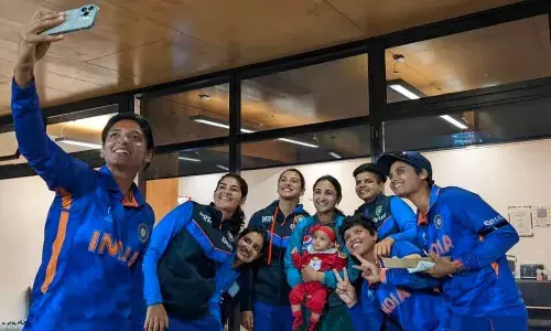 Indian womens cricket team players pose with Pakistan captain Bismah Maroofs daughter Fatima after the World Cup match