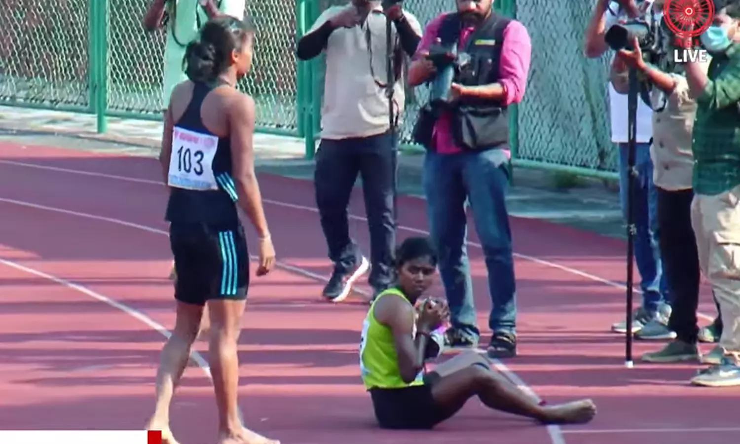 Hima Das, who finished second, goes up to Dhanalakshmi to congratulate her at the end of their race (Screenshot)