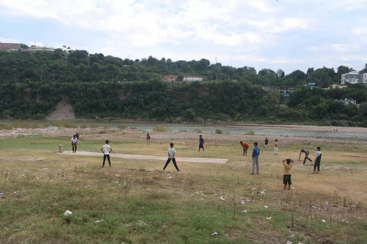 Locals play on a cement pitch in Gujjar Nagar (Bilal Kuchy)