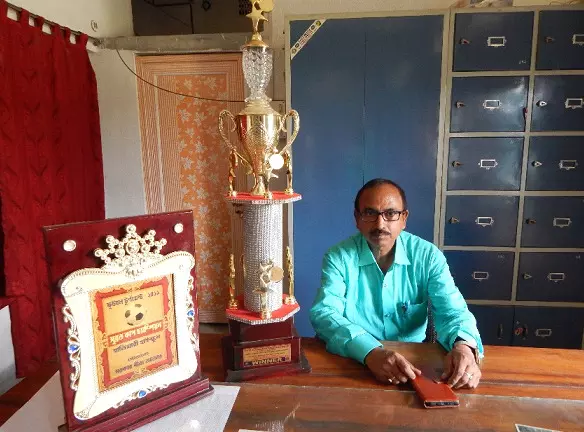 Headmaster Prasanta Kumar Ghosh with the U17 regional Subroto Cup