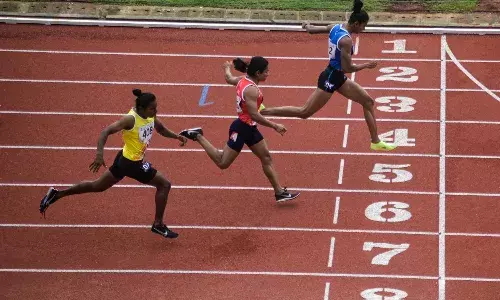 Priya Mohan, reaching the finishing line at the womens 200m race on Monday (Source: KIUG)