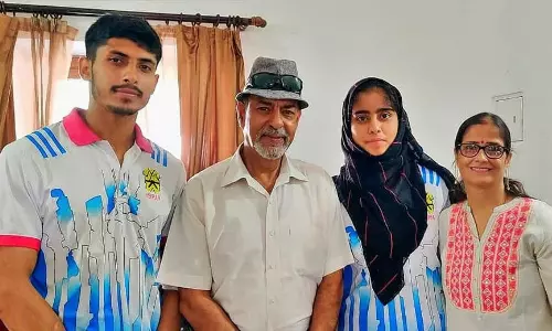Jammu and Kashmirs deaf judoka Rakshinda Mehak, who stood fifth at the Deaflympics, with her family