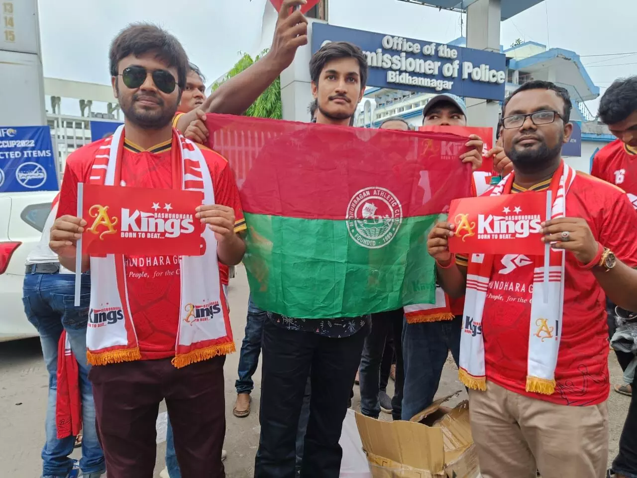 Bashundhara Kings fans pose with ATK Mohun Bagan supporters at the Salt Lake Stadium in Kolkata