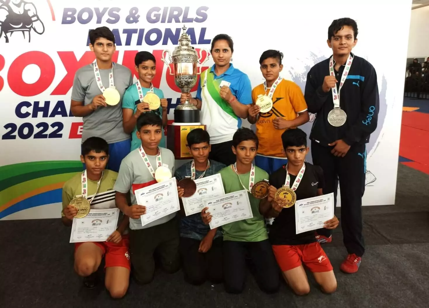 Haryana boxers pose with girls championships trophy
