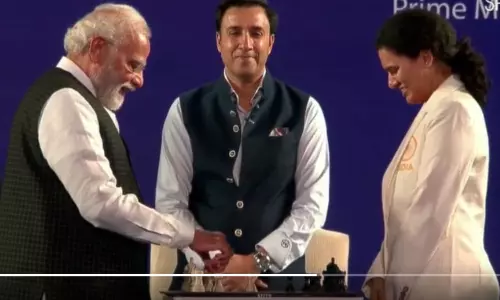 WATCH:  PM Modi plays chess with GM Koneru Humpy during Olympiad torch relay
