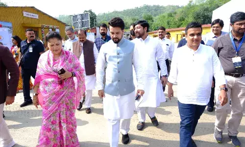 Union Sports Minister Anurag Thakur (centre)