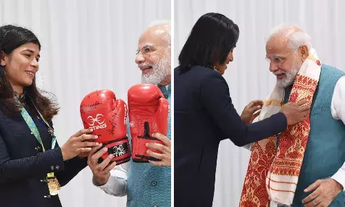 Nikhat gifts PM Modi boxing gloves; Hima gives traditional gamocha