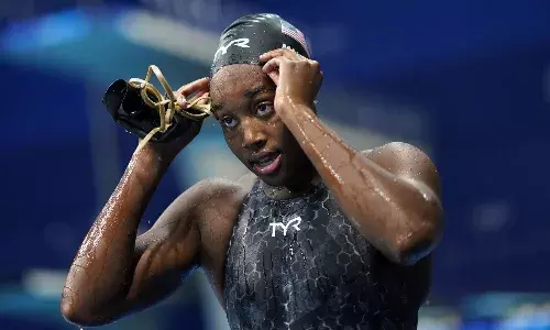 Swim cap for black hair gets race approval after Olympic ban
