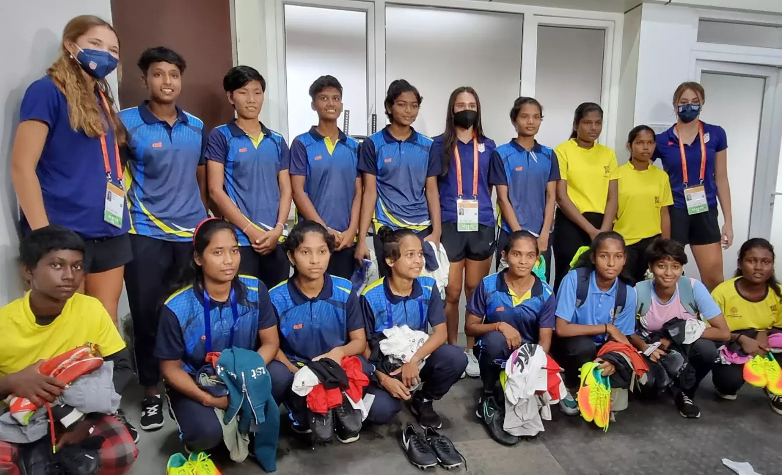 The USA U17 womens team with students of the girls hostel at the Kalinga Stadium