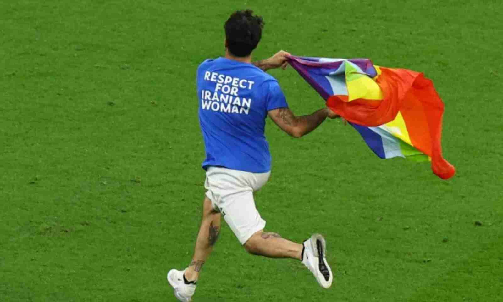 Soccer player from de back with rainbow flag color t-shirt