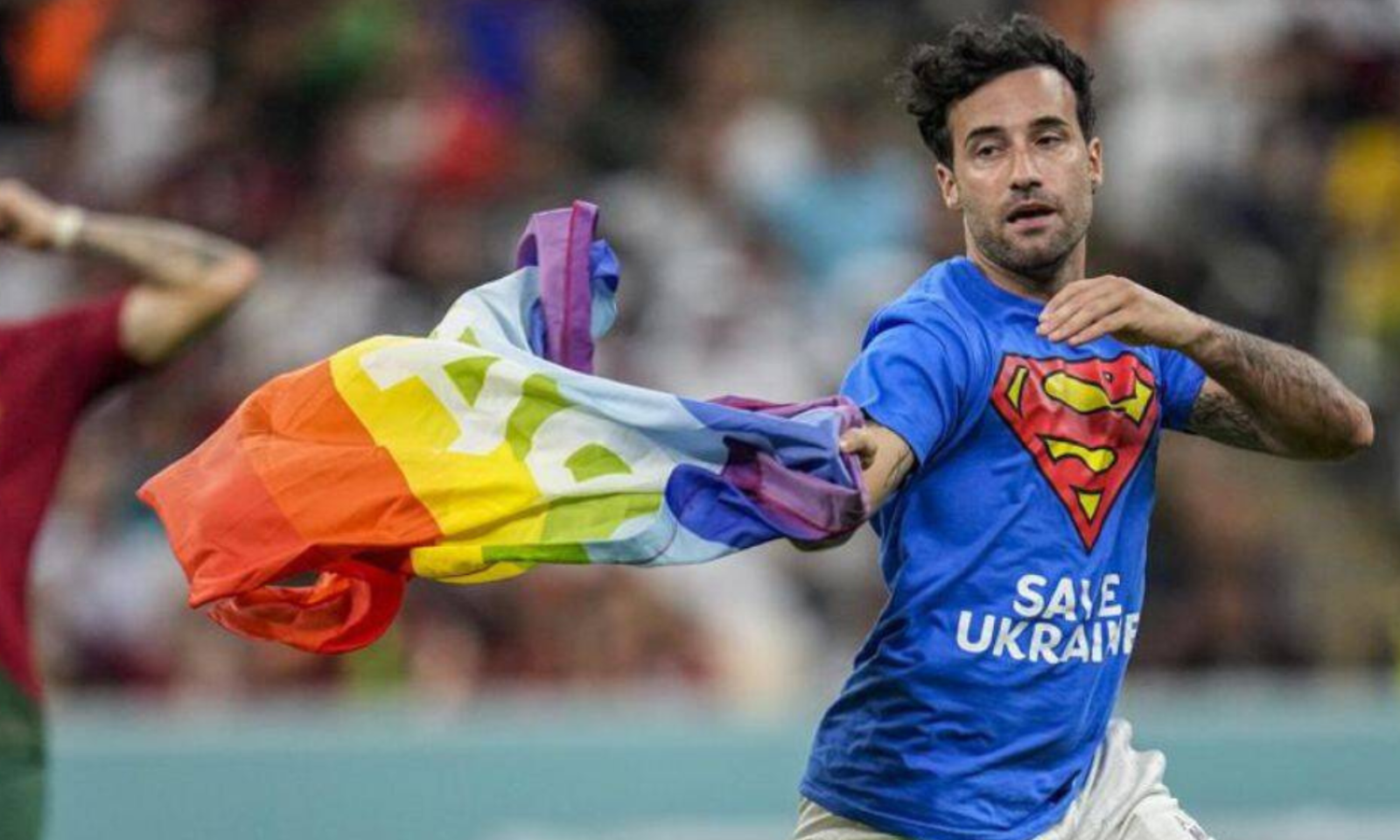 Man who invaded World Cup pitch with rainbow flag released from