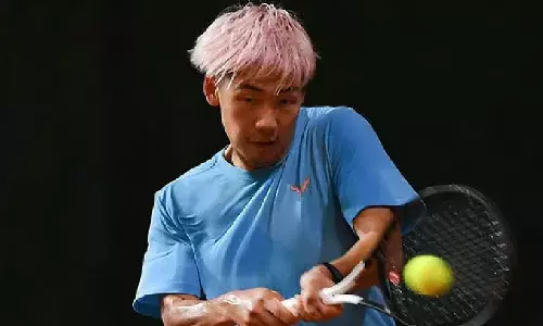 Chinese tennis player gets 9-month ban in match-fixing case