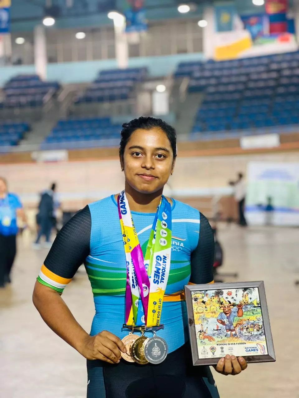 Triyasha Paul posing with her National Games medals.