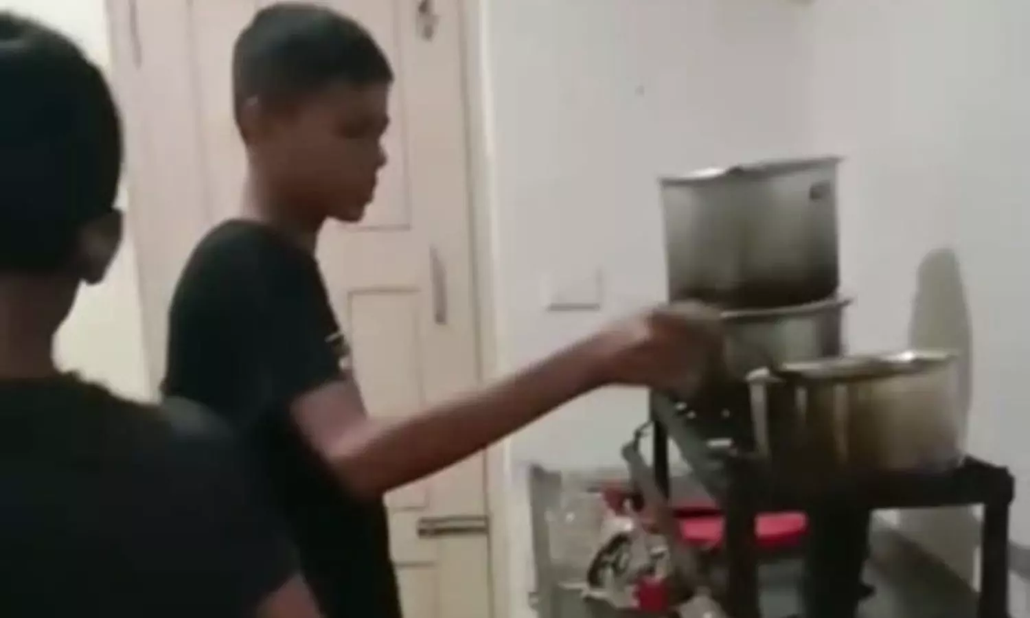 Budding footballers cooking their own meal at the Black Panther Footballing Club in Bengaluru