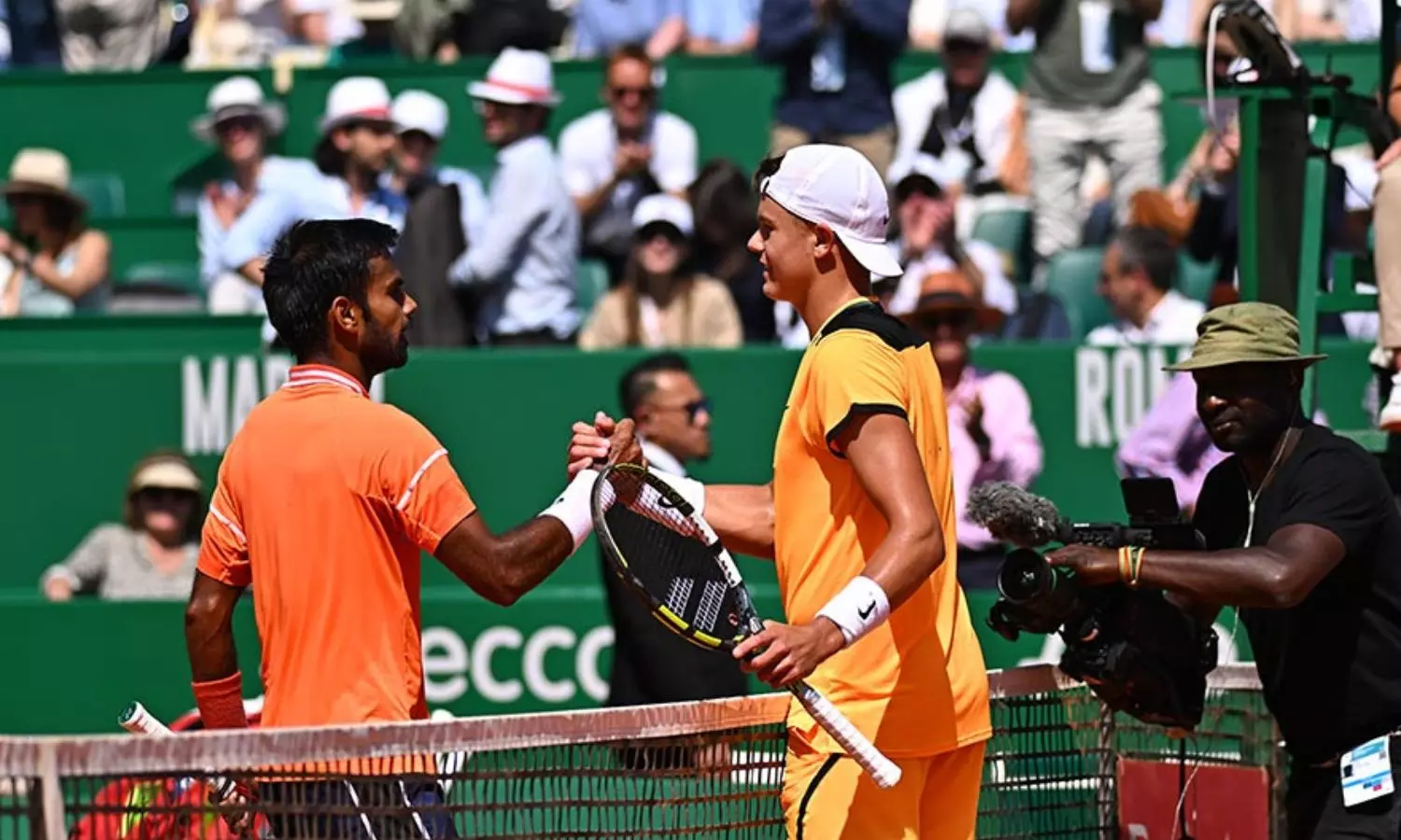 Sumit Nagal shakes hands with Holger Rune first losing his Monte Carlo Masters match. Sumit Nagal shakes hands with Holger Rune first losing his Monte Carlo Masters match.
