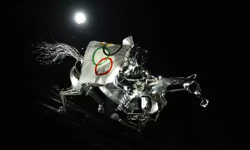 Who were the masked figures at the Paris Olympics opening ceremony?