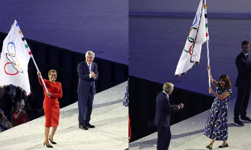 Paris bids adieu with first woman-to-woman transfer of Olympic flag