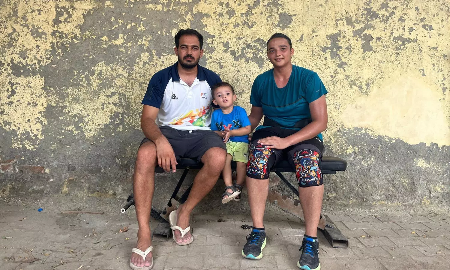 Seema (right) with husband Ravinder and son Rudra on the sidelines of the National Games in Dehradun. (Photo credit: Abhishek Mishra/The Bridge)