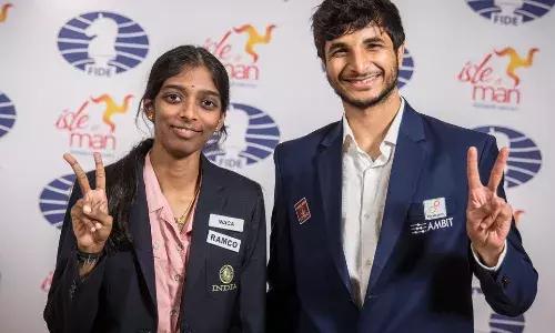 R Vaishali and Vidit Gujrathi after winning the 2023 Grand Swiss