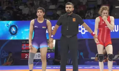Tapsya (blue) was crowned U20 World Wrestling Champion