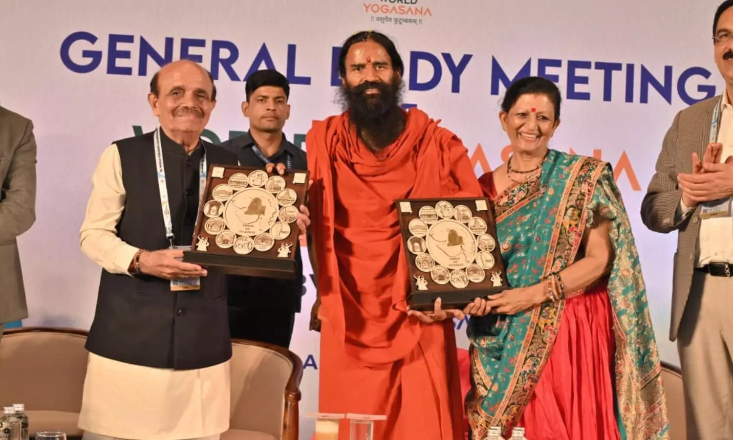 Swami Ramdev Honours Dr Jayaram Thakkar and Dr Kalpana Karia with Lifetime Achievement Awards at World Yogasana Meeting Swami Ramdev Honours Dr Jayaram Thakkar and Dr Kalpana Karia with Lifetime Achievement Awards at World Yogasana Meeting