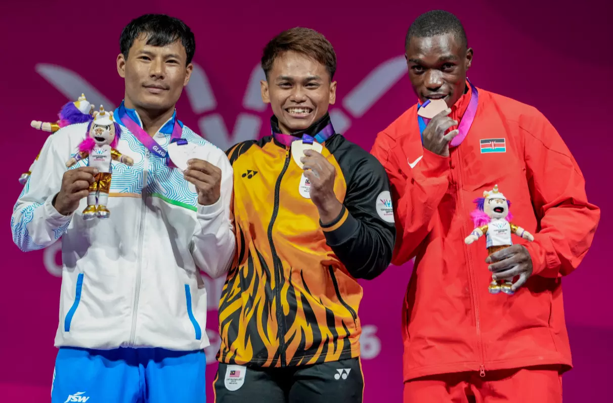 Mens 60 kg MedalistsAniq Kasdan (MAS) - in CentreRishikanta Singh (IND) - In LeftJoshua Mboya (KEN) - in Right