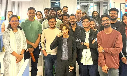 Nithin Kamath with The Bridge team in August 2024.