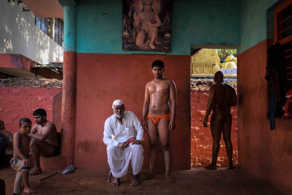 Shrimant Raghunath Chaugule, aged 70, poses with his grandson Akshay Chaugule, aged 18, at Shahupuri Akhara in Kolhapur. Shrimant and Akshay Chaugule are from Solapur district, 200 km away from Kolhapur. Akshay has been practising wrestling for the last eight years. Akshay’s grandfather stays with him and makes food for him so that he can concentrate on his practice. Shrimant Chaugule was also part of Shahupuri Akhara from 1968 to 1971. Photograph by Indrajit Khambe ©Sahapedia