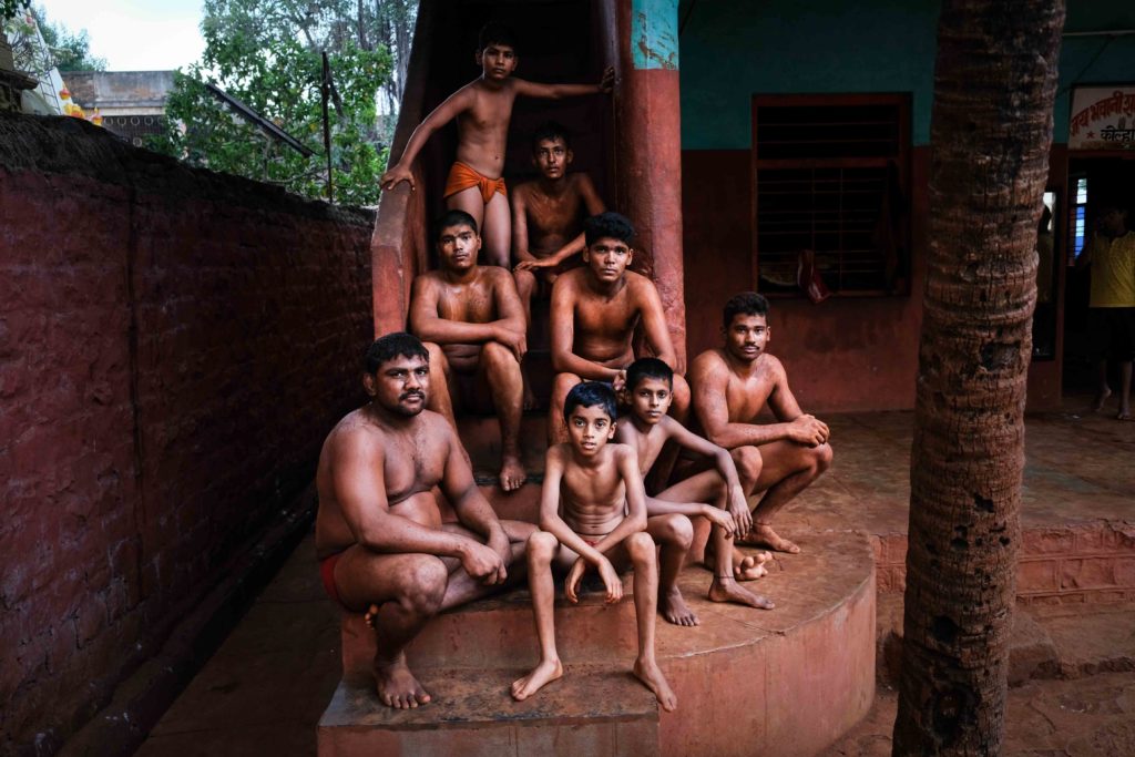 Wrestlers from various age groups pose for a photograph outside Shahupuri Akhara after the end of evening practice session around 6 pm. 