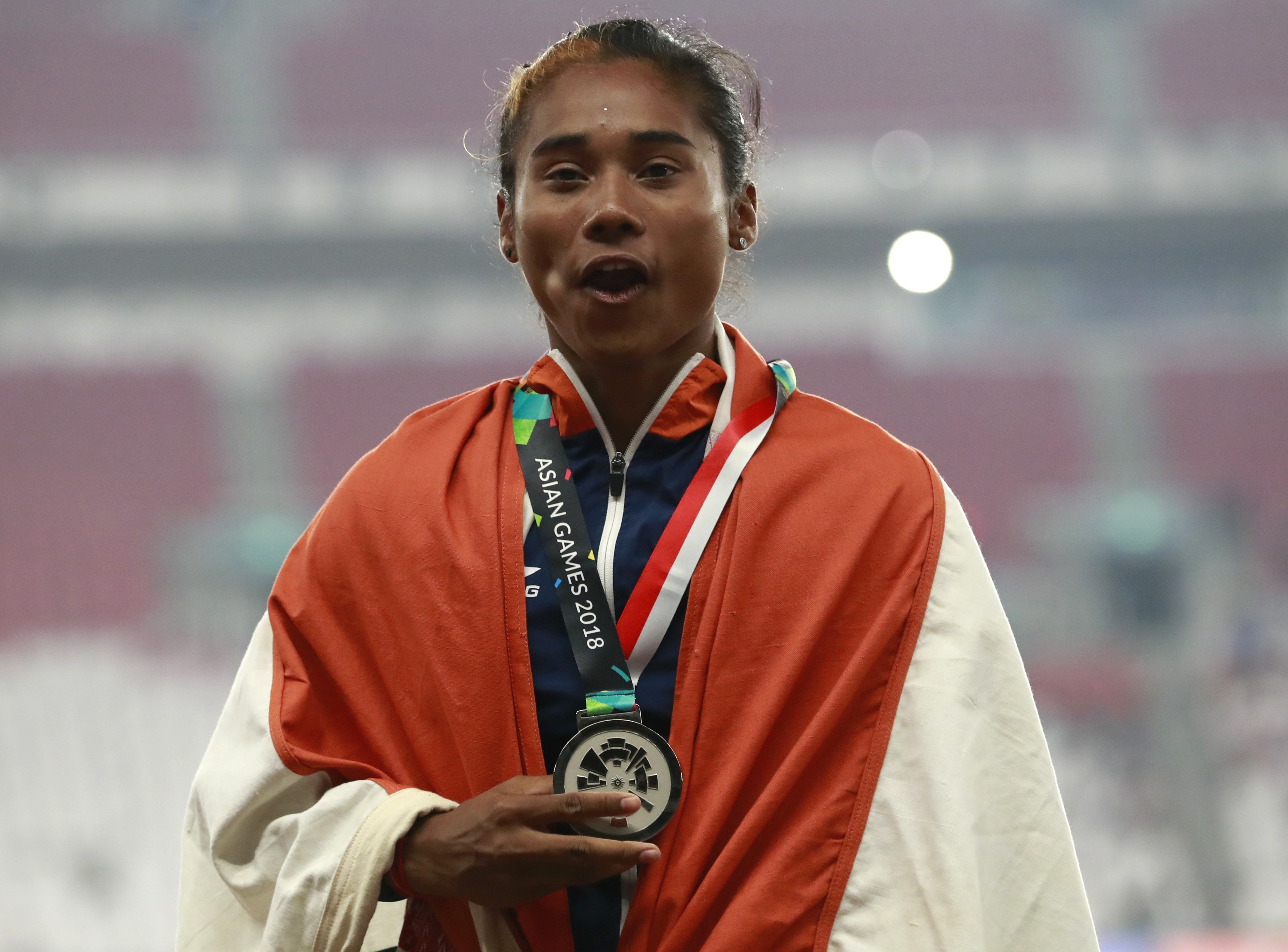 India's Hima Das celebrates with her silver medal for the women's 400m during the athletics competition at the 18th Asian Games in Jakarta, Indonesia. (Source: IAAF)