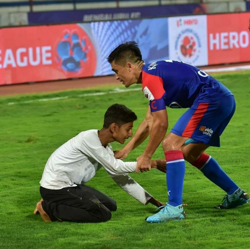 A young fan breached security to get to meet his idol Sunil Chetri (Source: Facebook)_ 