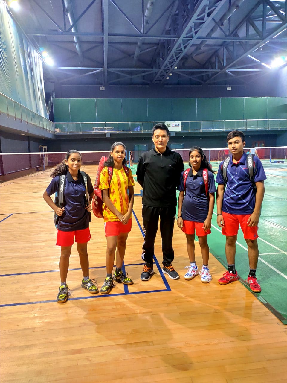 Chetan with 4 of his students at the Yonex academy 