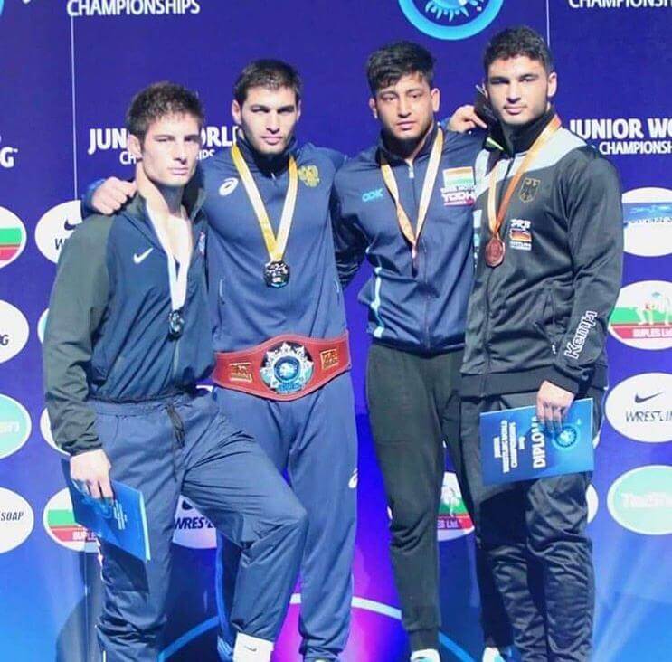 Vicky (second from right) with his fellow teammates at the Asian Wrestling Championships 2019.